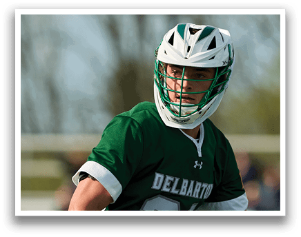 A man wearing a green and white jersey with the number 20 on it. Description generated by AI