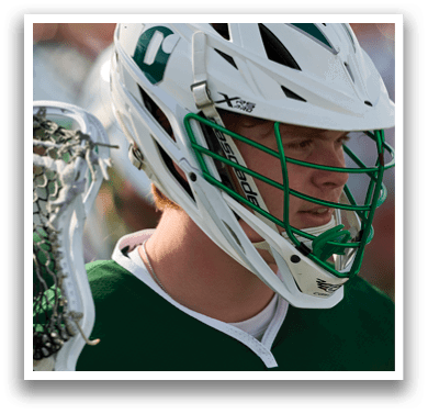 A man wearing a green and white helmet. Description generated by AI