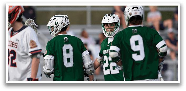 A group of men wearing green and white uniforms. Description generated by AI