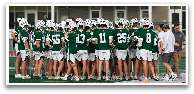 A group of men wearing green shirts and white shorts. Description generated by AI