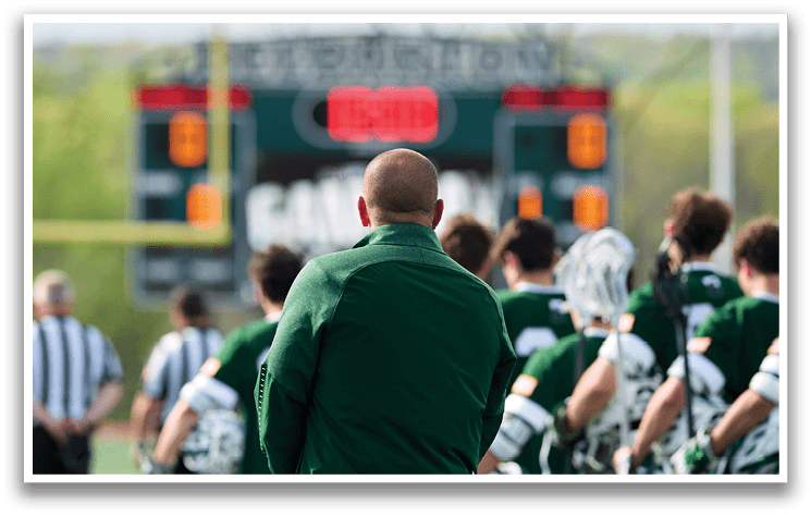 A group of men wearing green and white uniforms. Description generated by AI