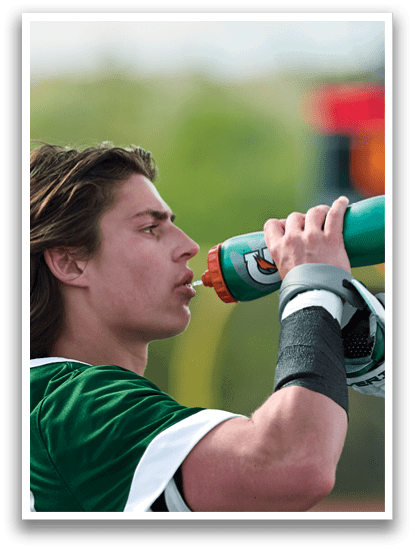 A man drinking from a bottle of water. Description generated by AI
