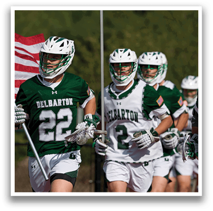 A group of men wearing green and white uniforms with the number 22 on the back. Description generated by AI