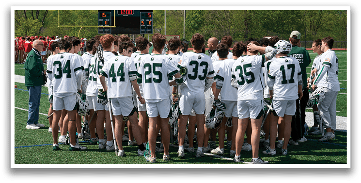 A group of people wearing green and white uniforms. Description generated by AI