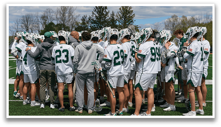 A group of people wearing white and green uniforms. Description generated by AI