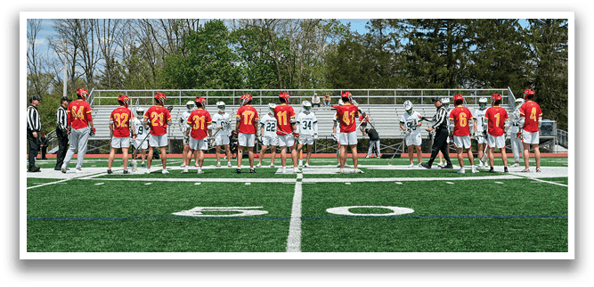 A group of people standing on a field. Description generated by AI