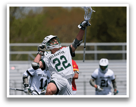 A man wearing a white and green jersey with the number 22 on it. Description generated by AI