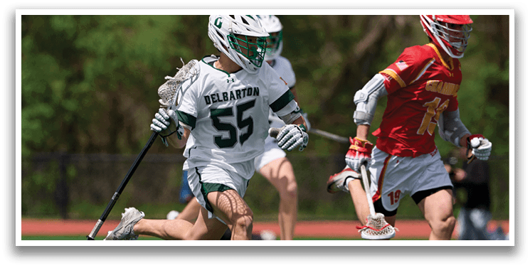 A man wearing a white jersey with the number 55 running on a field. Description generated by AI