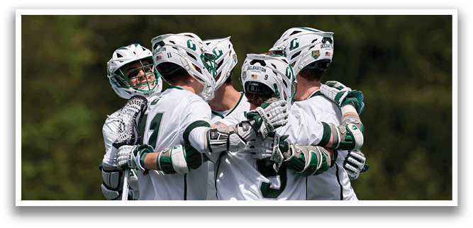A group of men wearing white uniforms and green and white helmets. Description generated by AI