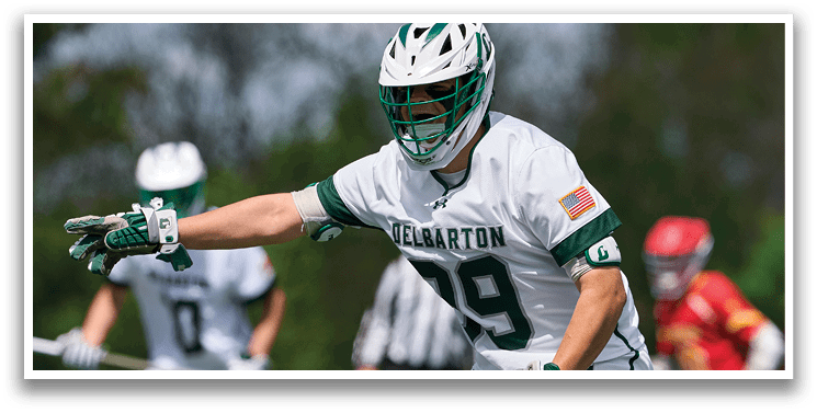 A man wearing a white and green jersey with the number 13 on it. Description generated by AI