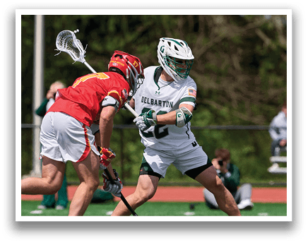 A man in a red jersey is trying to block a man in a white jersey from scoring a goal. Description generated by AI