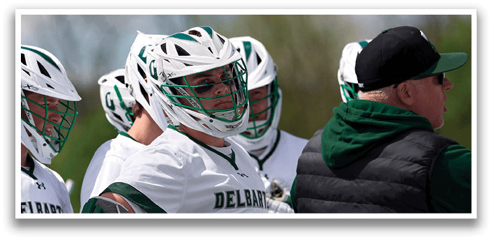 A group of men wearing white and green uniforms. Description generated by AI