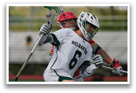 A man wearing a white jersey with the number 6 on it. Description generated by AI