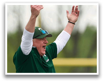 A man wearing a green shirt and white hat is celebrating. Description generated by AI
