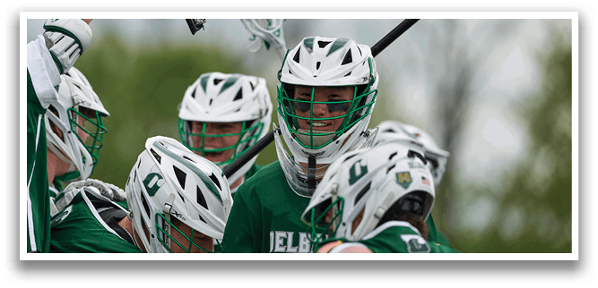 A group of people wearing green and white uniforms. Description generated by AI
