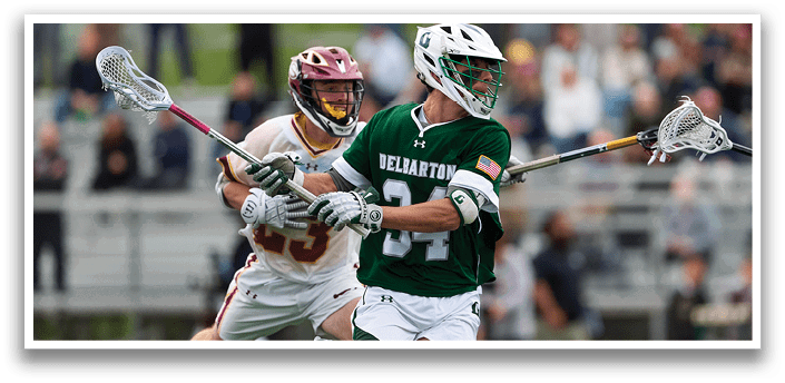 A man in a green and white uniform is running on a field. Description generated by AI