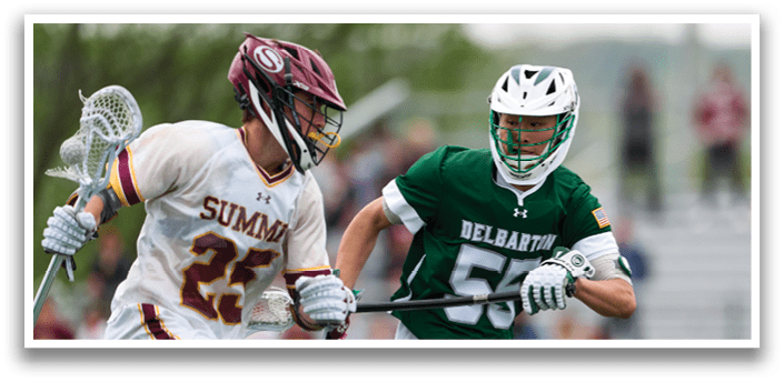 A man in a green shirt is running with a lacrosse stick. Description generated by AI