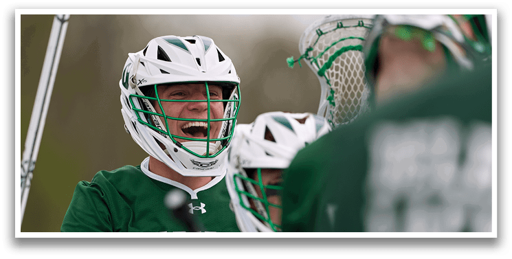 A group of people wearing green and white uniforms. Description generated by AI