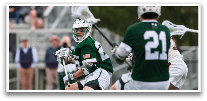 A group of men playing lacrosse. Description generated by AI