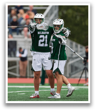 Two men wearing green and white uniforms. Description generated by AI