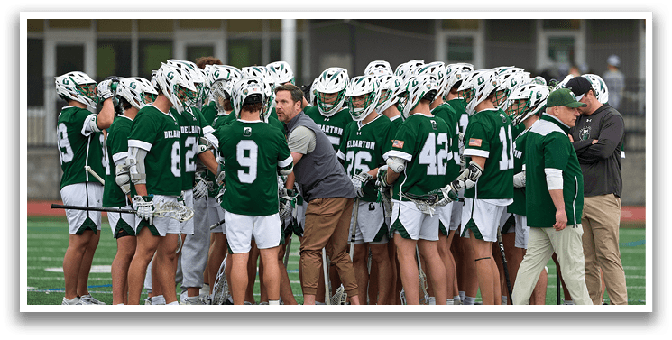 A group of people wearing green and white uniforms. Description generated by AI