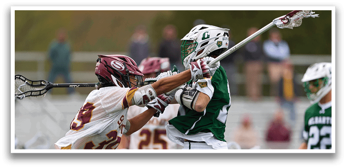 A group of people playing lacrosse. Description generated by AI