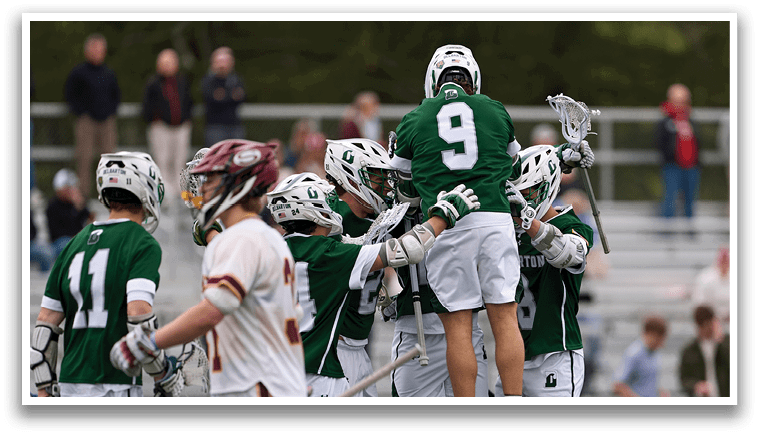 A group of people wearing green and white uniforms. Description generated by AI