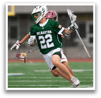 A man wearing a green and white jersey with the number 22 on it. Description generated by AI