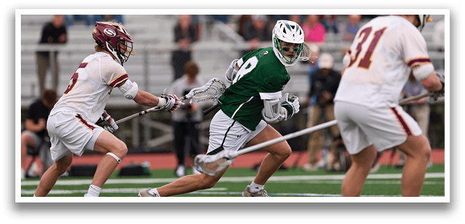 A man in a green shirt and white shorts running on a field. Description generated by AI