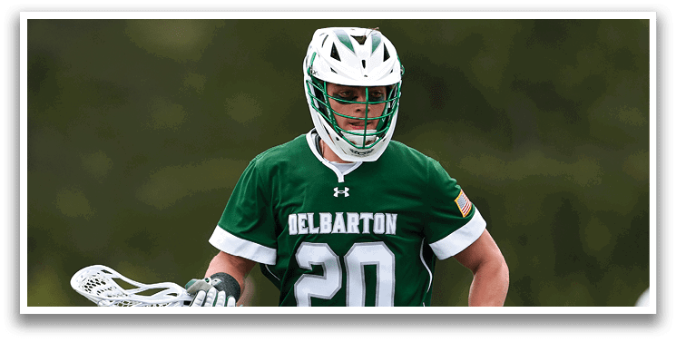 A man wearing a green jersey with the number 20 is running on a field. Description generated by AI