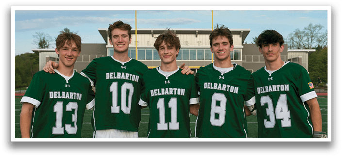 Five men wearing green jerseys with the number 11, 18, 19, 24, and 34 on them. Description generated by AI
