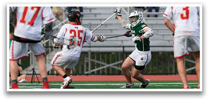 A group of people playing a game of lacrosse. Description generated by AI