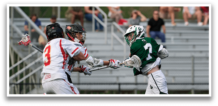 A man in a green jersey is running with a lacrosse stick. Description generated by AI