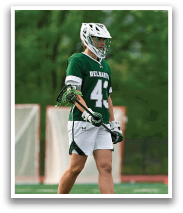 A person wearing a green and white uniform with the number 41 on it. Description generated by AI