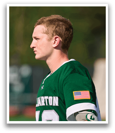 A man wearing a green and white jersey with the number 12 on it. Description generated by AI