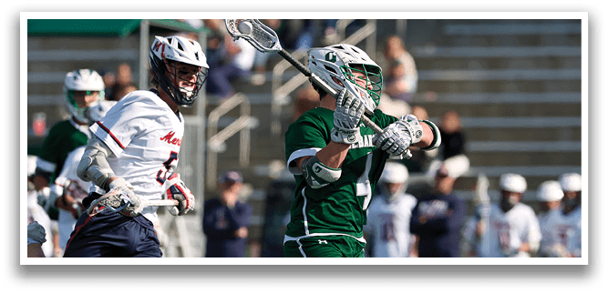 A man in a green and white uniform is running on a field. Description generated by AI