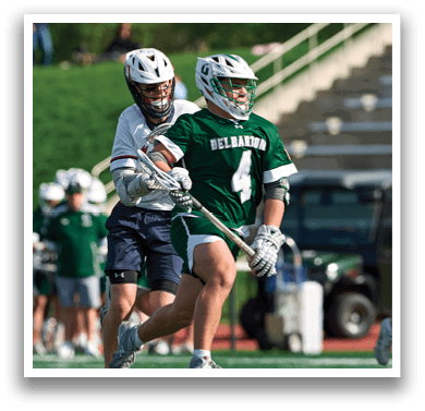 A man in a green jersey with the number 4 on it is running with a stick. Description generated by AI