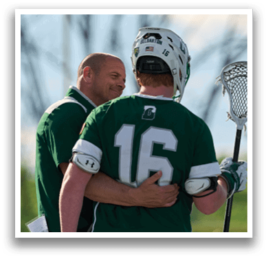 A man wearing a green shirt with the number 16 on it. Description generated by AI