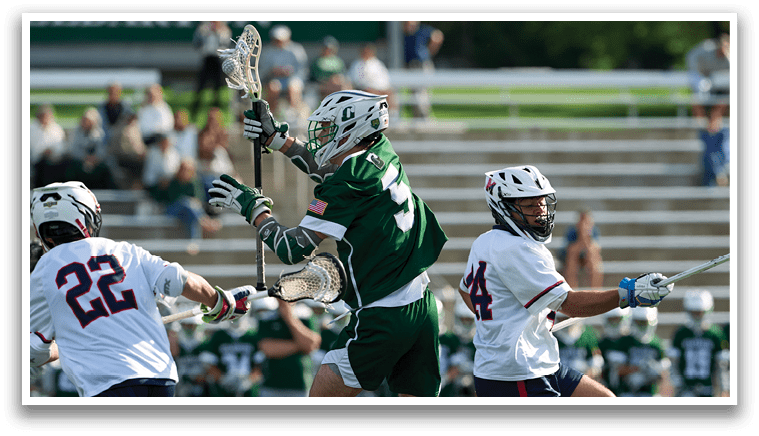 A group of people playing lacrosse. Description generated by AI