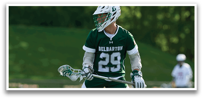 A man wearing a green and white jersey with the number 29 on it. Description generated by AI