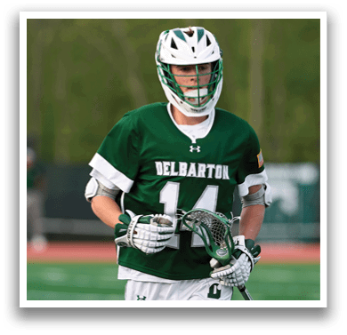A man wearing a green and white jersey with the number 14 on it. Description generated by AI