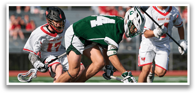 A group of men playing a game of lacrosse. Description generated by AI