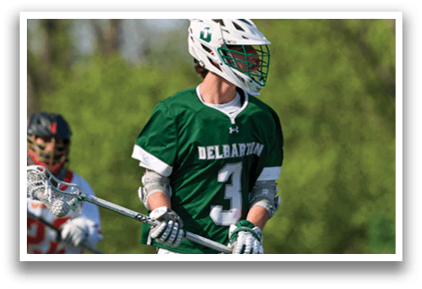 A man wearing a green jersey with the number 3 on it. Description generated by AI