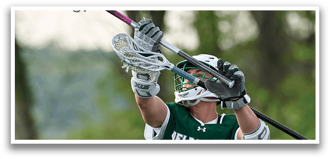 A man wearing a green and white jersey with the number 39 on it. Description generated by AI