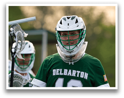 A man wearing a green and white jersey with the number 12 on it. Description generated by AI