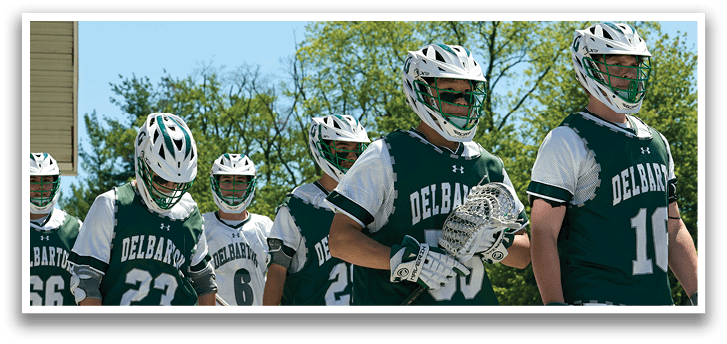 A group of people wearing green and white uniforms. Description generated by AI