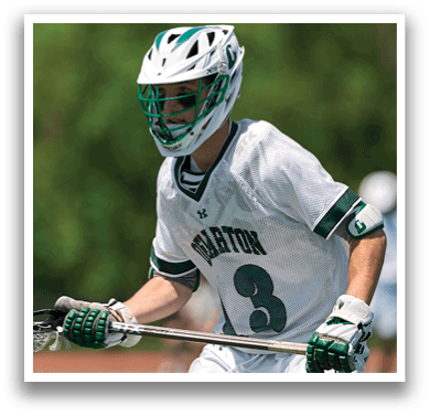A man wearing a white and green shirt with the number 3 on it. Description generated by AI