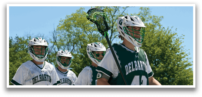 Three men wearing green and white uniforms. Description generated by AI
