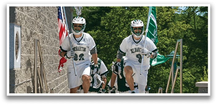 Two men wearing helmets and white uniforms. Description generated by AI