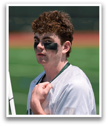 A man with a black and white face mask. Description generated by AI